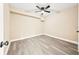 A spacious bedroom features light gray wood-look floors, neutral walls, and natural light at 7301 S Swoope St, Tampa, FL 33616