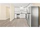 Modern kitchen showcasing white cabinets, stainless steel appliances, and sleek granite countertops at 7301 S Swoope St, Tampa, FL 33616