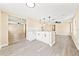 This kitchen has modern light fixtures, granite counters, and white cabinets at 7301 S Swoope St, Tampa, FL 33616