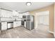 Contemporary kitchen featuring stainless steel appliances, white cabinets, and modern fixtures at 7301 S Swoope St, Tampa, FL 33616