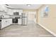 Bright, newly renovated kitchen features stainless appliances, white cabinets, and ample countertops at 7301 S Swoope St, Tampa, FL 33616