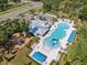 Aerial view of the community featuring the pool, clubhouse, playground and parking at 7326 Blue Beech Dr, Riverview, FL 33578