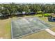 Community basketball court with trees and grass area at 7326 Blue Beech Dr, Riverview, FL 33578