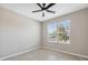 Cozy bedroom with a ceiling fan, and a window offering natural light at 7326 Blue Beech Dr, Riverview, FL 33578