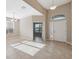 Bright foyer featuring tile flooring and an open floor plan with access to other rooms at 7326 Blue Beech Dr, Riverview, FL 33578