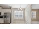 Bright kitchen nook features stainless steel appliances and tile flooring at 7326 Blue Beech Dr, Riverview, FL 33578