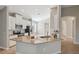 Kitchen island with granite countertop and stainless steel appliances at 7326 Blue Beech Dr, Riverview, FL 33578