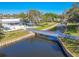 Aerial view of a waterway, green space, bridge, and nearby white buildings at 8325 112Th St # 202, Seminole, FL 33772