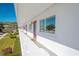 The white balcony offers community views and access to the red front door at 8325 112Th St # 202, Seminole, FL 33772