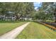 Well-maintained lawns with mature trees, and a waterway at 8325 112Th St # 202, Seminole, FL 33772