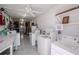 Bright laundry room with multiple washers, dryers, and utility sink for added convenience at 8325 112Th St # 202, Seminole, FL 33772