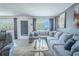 Spacious living room with plush seating, neutral decor, and plenty of natural light at 8325 112Th St # 202, Seminole, FL 33772