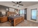 Spacious main bedroom with a ceiling fan, access to the lanai, and neutral carpeting at 8325 112Th St # 202, Seminole, FL 33772