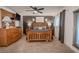 Spacious main bedroom with a ceiling fan, wood furniture, and neutral carpeting at 8325 112Th St # 202, Seminole, FL 33772