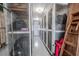 Long storage hallway featuring storage cages and a ladder for easy access at 8325 112Th St # 202, Seminole, FL 33772