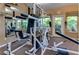 Fitness center featuring weight training equipment, mirrors, and natural light at 9100 Dr Martin Luther King Jr N St # 405, St Petersburg, FL 33702