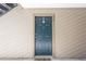 Front door of condo unit with house number and custom door knocker in a waterfront community at 9100 Dr Martin Luther King Jr N St # 405, St Petersburg, FL 33702