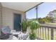 Charming, furnished, screened lanai with a view of the lush, green outdoors at 9100 Dr Martin Luther King Jr N St # 405, St Petersburg, FL 33702