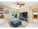 Bright living room with large TV, comfortable seating and sliding doors to the balcony in a waterfront condo at 9100 Dr Martin Luther King Jr N St # 405, St Petersburg, FL 33702