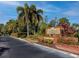 Exterior shot of 'The Enclave' community sign nestled amid lush landscaping at 9100 Dr Martin Luther King Jr N St # 405, St Petersburg, FL 33702