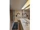 Bathroom featuring a walk-in shower, toilet, vanity with mirror, and neutral decor at 1010 Bowsprit Ln # 0, Holiday, FL 34691