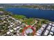 Stunning aerial view of property near the lake with lush greenery, beautiful neighborhood, and water views at 10128 114Th N Ter, Largo, FL 33773