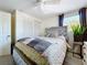 Bedroom featuring a queen-sized bed with plush pillows, natural lighting, and a ceiling fan at 10128 114Th N Ter, Largo, FL 33773