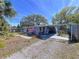 Quaint home boasting a covered patio, lush landscaping, and inviting curb appeal at 10128 114Th N Ter, Largo, FL 33773