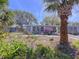 Inviting single-story home with lush landscaping and a welcoming front yard at 10128 114Th N Ter, Largo, FL 33773