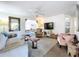 This open living room features a ceiling fan and doorways to other rooms in the house at 10128 114Th N Ter, Largo, FL 33773