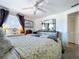 Spacious main bedroom with soft lighting, ceiling fan, and serene decor at 10128 114Th N Ter, Largo, FL 33773