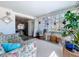 Cozy sunroom with plants, view to kitchen, and access to the outdoors at 10128 114Th N Ter, Largo, FL 33773