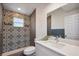 Modern bathroom features decorative patterned tile and brushed nickel fixtures at 10847 Bounty St, New Port Richey, FL 34654