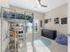 The cozy bedroom includes a lofted bed with a desk and shelving at 11432 Leland Groves Dr, Riverview, FL 33579