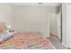 This bedroom offers a ceiling fan and access to the closet and hallway at 11432 Leland Groves Dr, Riverview, FL 33579