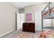This bedroom features a lofted bed, closet, and dresser at 11432 Leland Groves Dr, Riverview, FL 33579