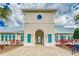 South Fork Lakes clubhouse with arched entrance and blue shutters at 11432 Leland Groves Dr, Riverview, FL 33579