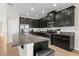 Modern kitchen with stainless steel appliances, granite countertops, and ample cabinet space at 11432 Leland Groves Dr, Riverview, FL 33579