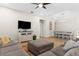 Open concept living space showcasing a TV, dining area, and stylish furnishings at 11432 Leland Groves Dr, Riverview, FL 33579
