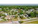 An aerial perspective captures the property's location amidst a blend of residential homes and rich green foliage at 1211 E Camellia Dr., Brandon, FL 33510