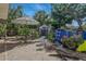 Backyard featuring a above ground pool and patio furniture under an umbrella at 1211 E Camellia Dr., Brandon, FL 33510