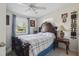 Bedroom featuring an ornate headboard, side tables, lamps and decor at 1211 E Camellia Dr., Brandon, FL 33510