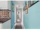 Hallway with light blue walls, decor and a rug at 1211 E Camellia Dr., Brandon, FL 33510