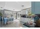 Bright kitchen with white cabinets, modern appliances, and an adjacent dining area bathed in natural light at 1211 E Camellia Dr., Brandon, FL 33510