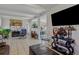 Bright living room featuring tile floors, a fireplace, and ample space for furniture and decor at 1211 E Camellia Dr., Brandon, FL 33510