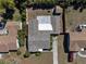 Aerial view of house featuring a large yard, shed, and well-maintained roof at 1223 Union St, Clearwater, FL 33755