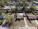 Aerial view of house featuring a large yard, shed, landscaping, and street view at 1223 Union St, Clearwater, FL 33755
