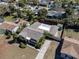 Aerial view of yellow house with well-kept yard and landscaping at 1223 Union St, Clearwater, FL 33755