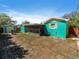 Expansive backyard with shed and enclosed patio, offering various spaces for outdoor enjoyment at 1223 Union St, Clearwater, FL 33755