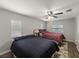 Comfortable bedroom features neutral paint, ceiling fan, and two beds for flexible arrangements at 1223 Union St, Clearwater, FL 33755